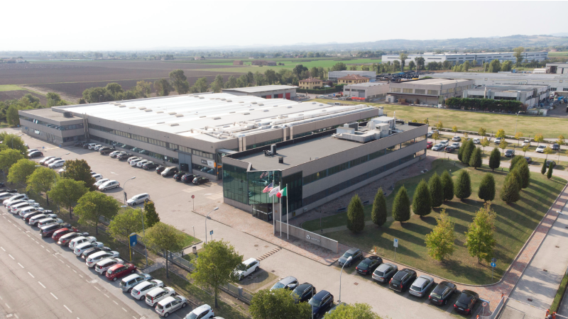 A building structure with lots of trees and cards